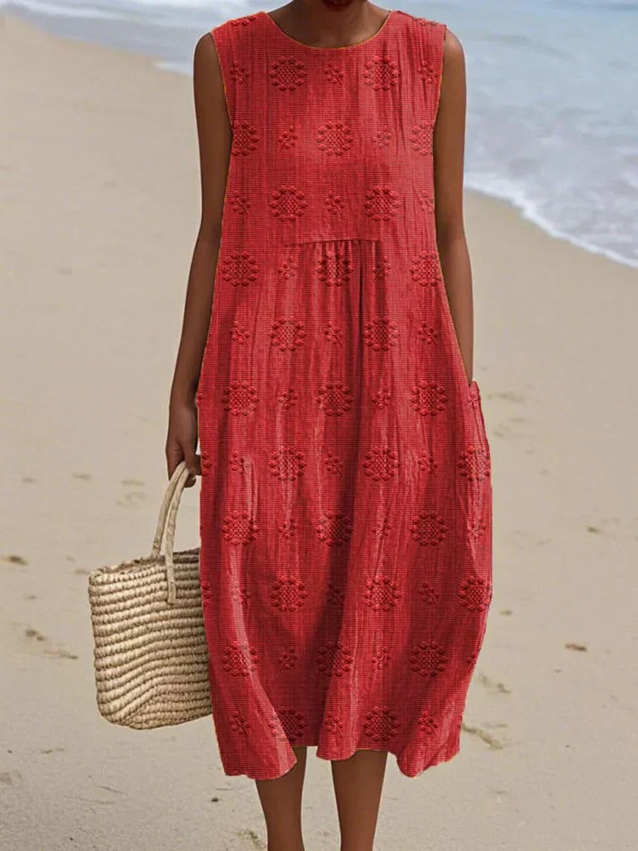 Women's sleeveless midi dress with embroidered circular motifs, breezy casual style for travel