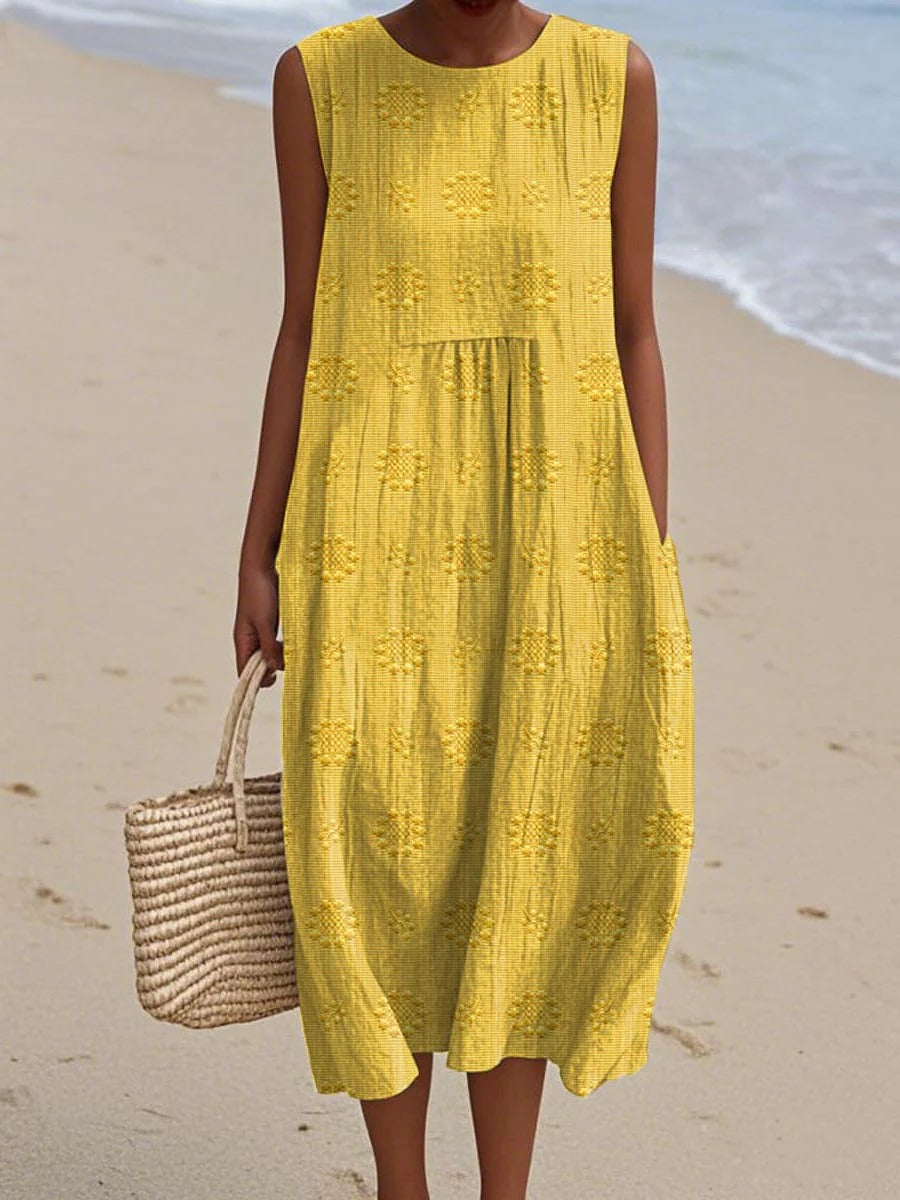 Women's sleeveless midi dress with embroidered circular motifs, breezy casual style for travel