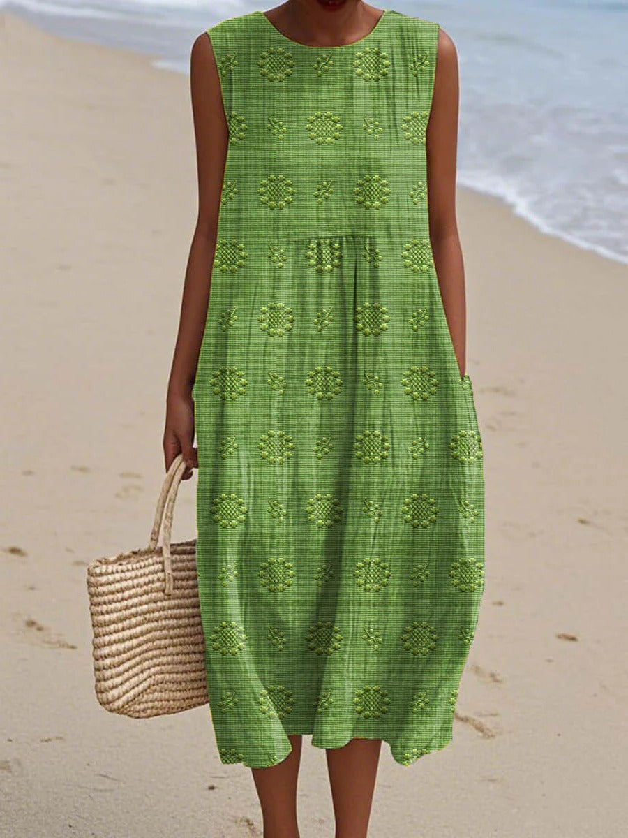 Women's sleeveless midi dress with embroidered circular motifs, breezy everyday travel style