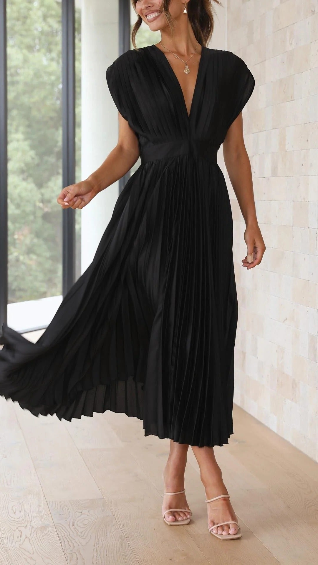 Women's pleated v-neck maxi dress in elegant flowing silhouette with refined pleats for formal and daywear