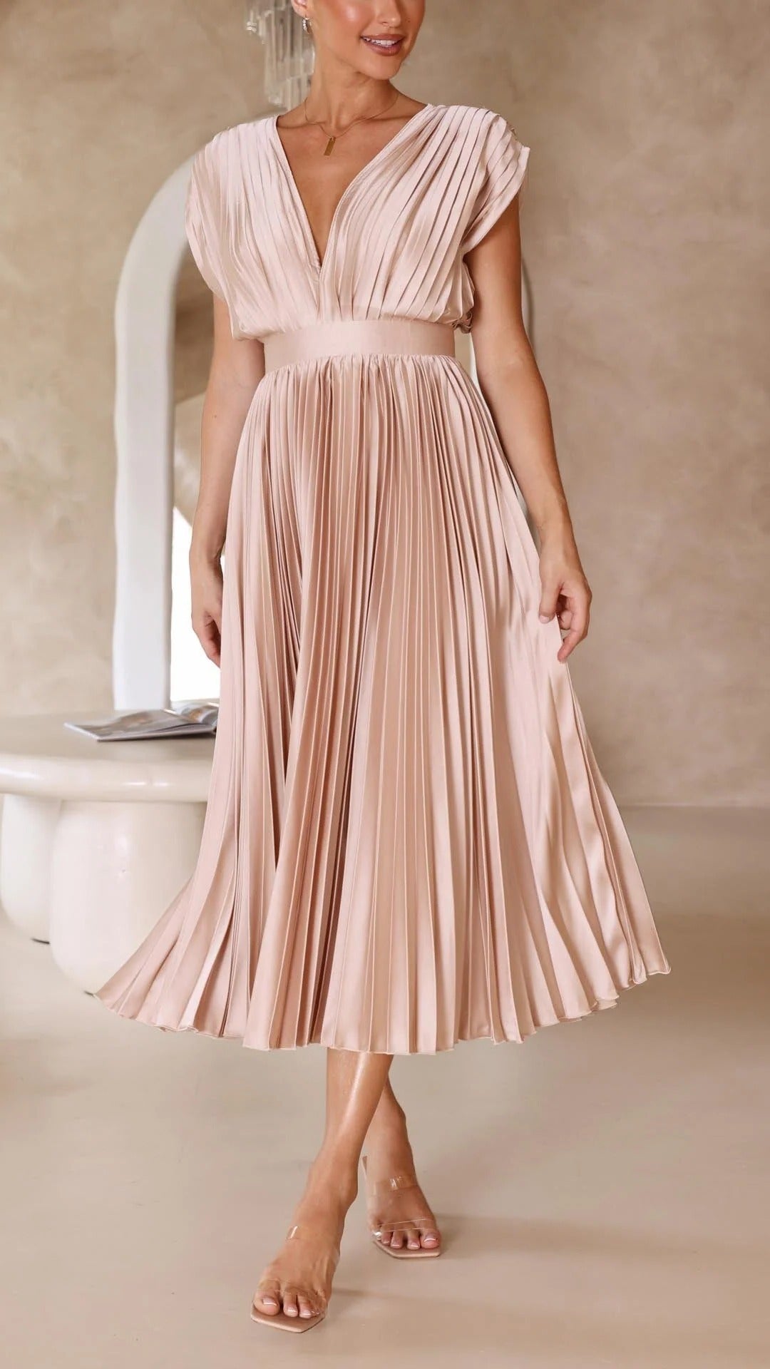 Women's pleated V-neck maxi dress in flowing silhouette with light-catching textured pleats for formal chic style