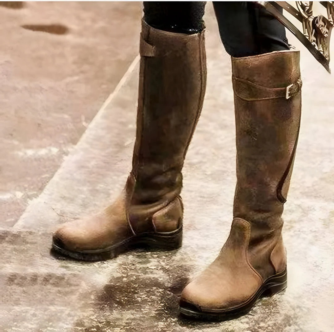 Women's waterproof knee-high boots in rugged outdoor style with lightweight construction and grip sole