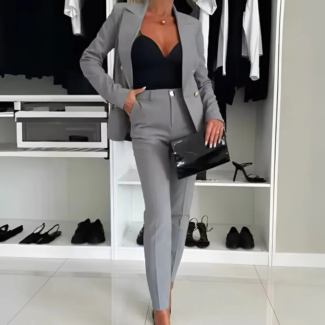 Women's black double-breasted blazer and straight-leg tailored trousers set for sharp style