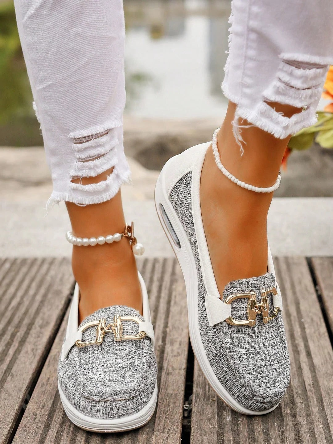 Women's slip-on loafers with gold buckle detail, flat wedge sole, polished everyday style