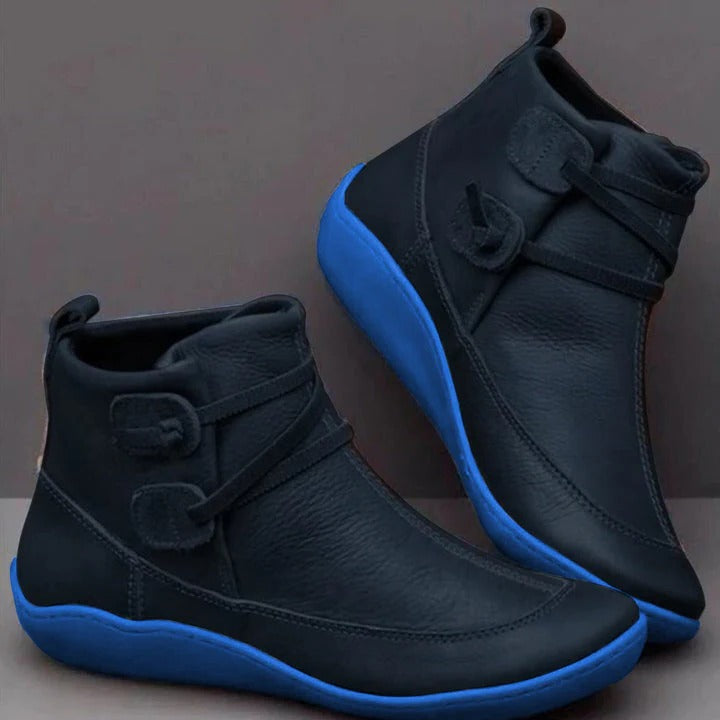Black waterproof ankle boots with cushioned interior and sleek city-ready silhouette for all-weather wear