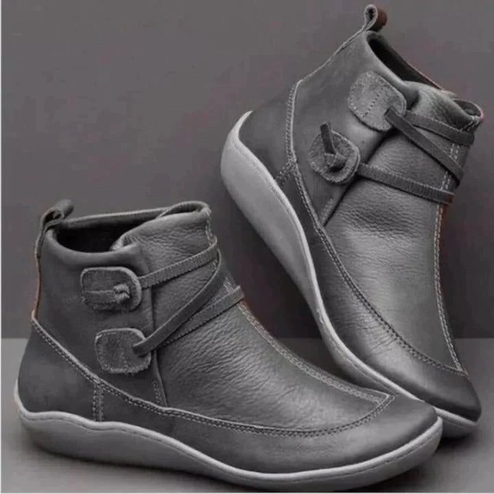 Black waterproof ankle boots with cushioned interior, clean silhouette for all-weather city walks