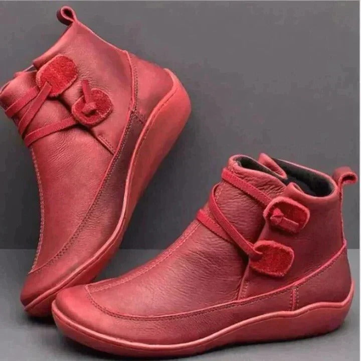 Black waterproof ankle boots with cushioned interior, clean silhouette for all-weather city wear