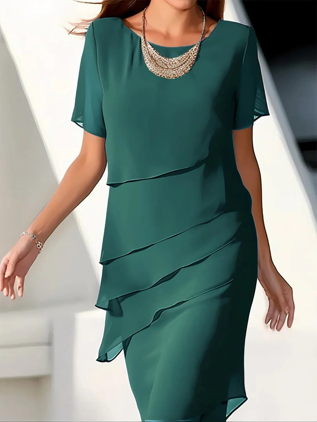 Women's black tiered maxi dress with cascading layered silhouette and effortless flowy fit