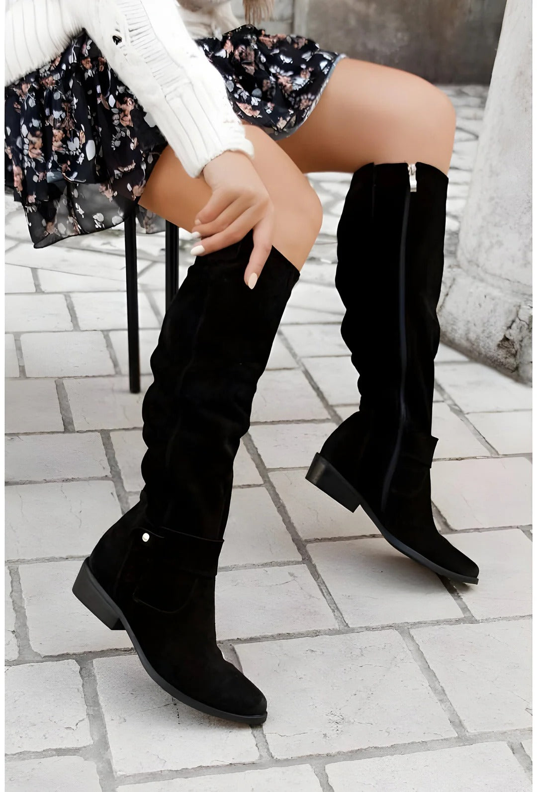 Women's black knee-high boots with structured support, sleek silhouette, and cushioned insole for all-day comfort