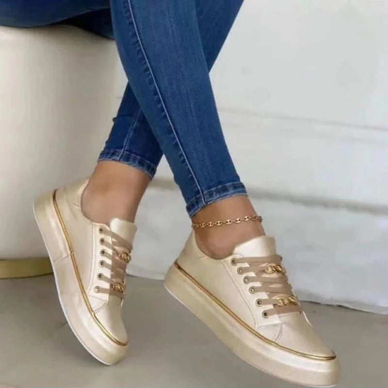 Women's white platform low-top lace-up sneakers with non-slip rubber sole and subtle lift