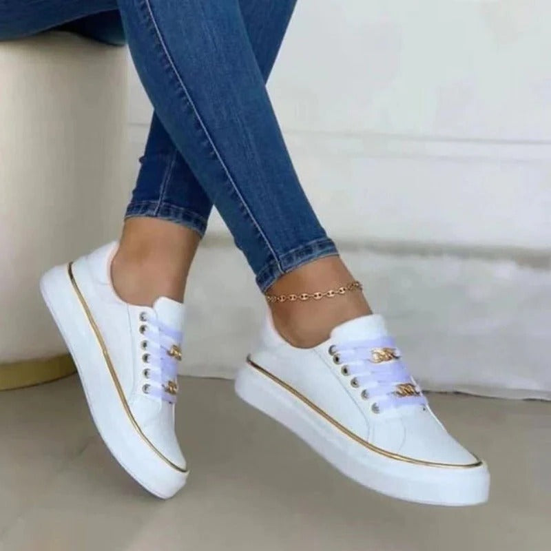 Women's white platform low-top lace-up sneakers with non-slip rubber sole and subtle lift