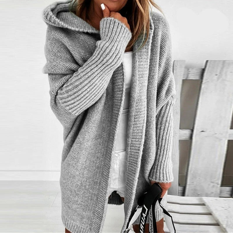 Oversized hooded knit cardigan relaxed silhouette cozy layering piece with extra-coverage hood for casual wear