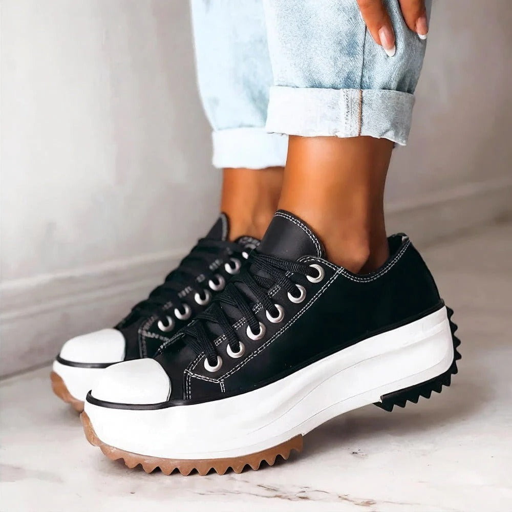 Women's white platform low-top sneakers with cushioned sole and breathable lightweight design