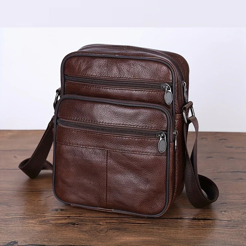 Men's black structured shoulder bag with multi-pocket organization, sleek professional silhouette
