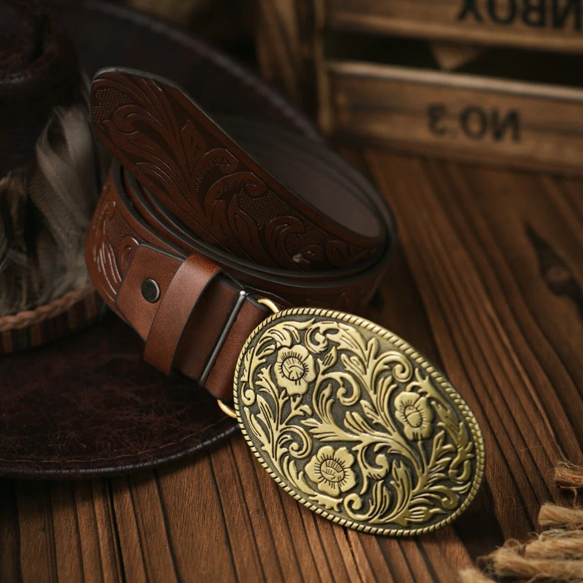 Men's hand-tooled brown leather western belt with ornate brass buckle for casual and formal wear