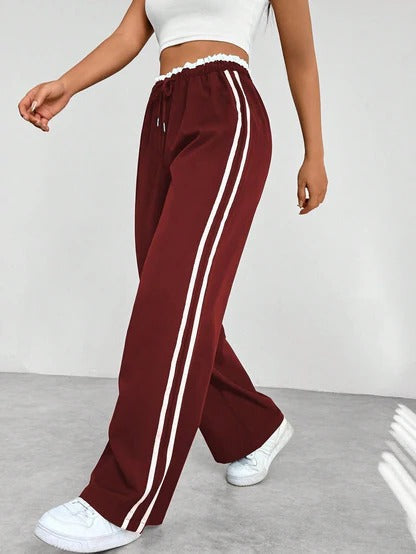 Black wide-leg sporty pants relaxed athleisure cut with adjustable drawstring elastic waistband