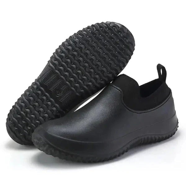 Black slip-on waterproof work shoes lace-free design for professionals with all-day dry comfort protection