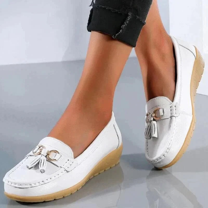 Women's brown premium leather orthopedic loafers with ergonomic insole and professional slip-on silhouette