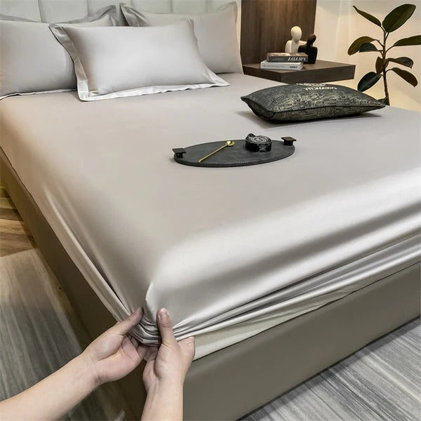 Fitted sheet with elastic edges, soft smooth surface, secure deep mattress fit, versatile bedroom style