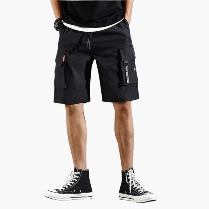 Men's khaki relaxed-fit cargo shorts with multiple utility pockets for travel and outdoor comfort