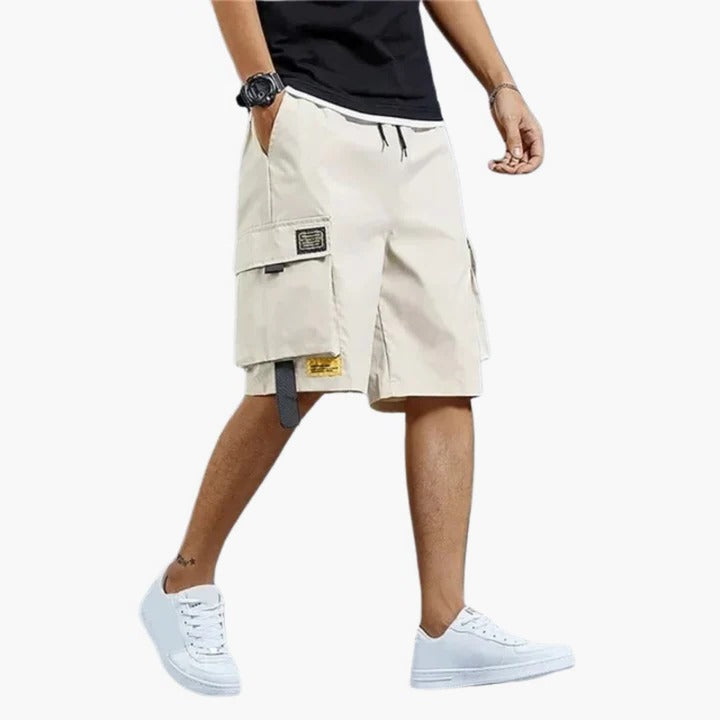 Men's relaxed-fit cargo shorts in neutral tone with multiple utility pockets for travel and outdoor wear