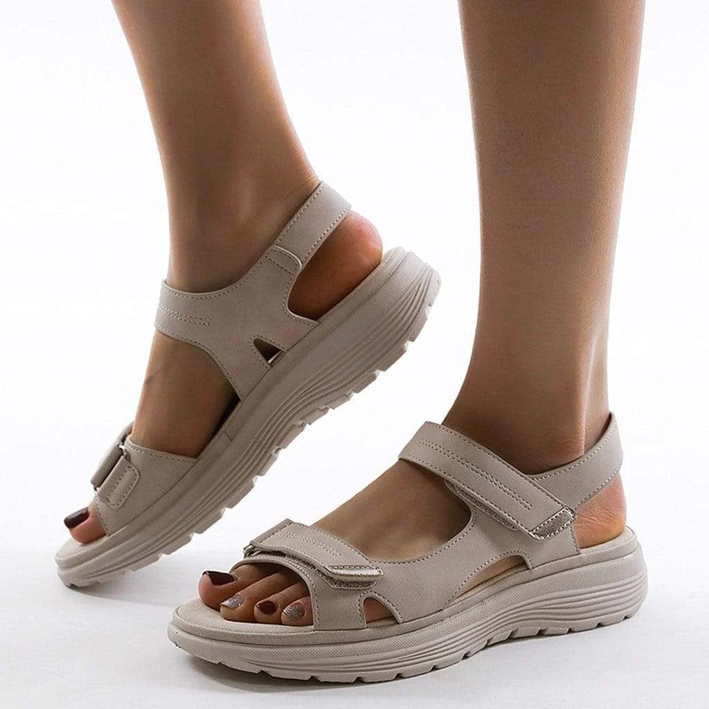 Women's beige orthopedic sandals with arch support, adjustable straps, and ergonomic cushioned sole