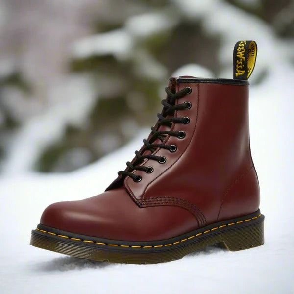 Men's brown leather ankle boots with lace-up design and distinctive yellow stitch detailing