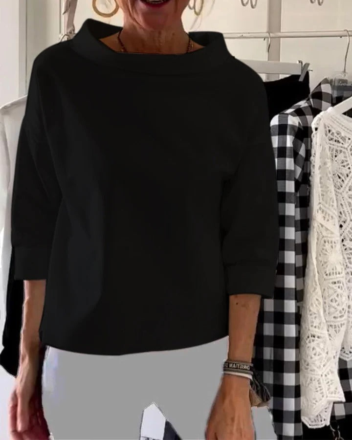 Women's elegant high collar long sleeve top in minimalist style, versatile desk-to-dinner silhouette