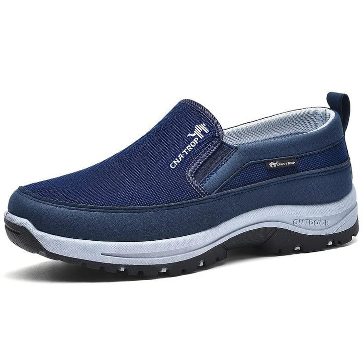 Men's black orthopedic slip-on shoes with wide toe box, arch support, and waterproof construction