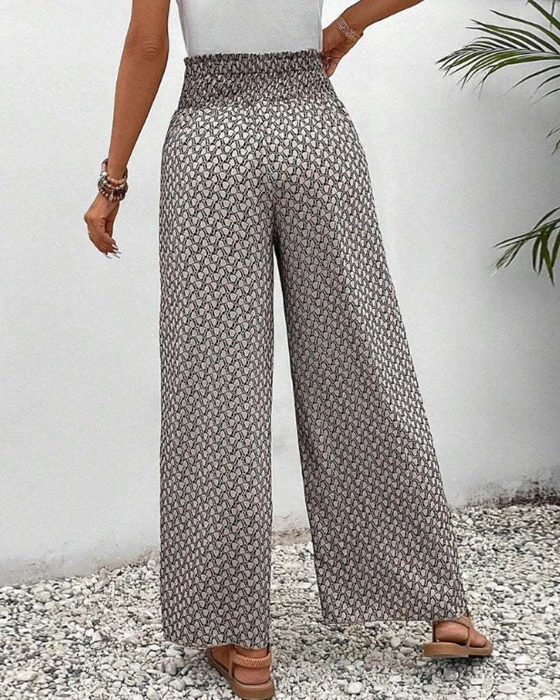 Women's high-waisted summer pants with bold geometric print, flattering silhouette for modern style