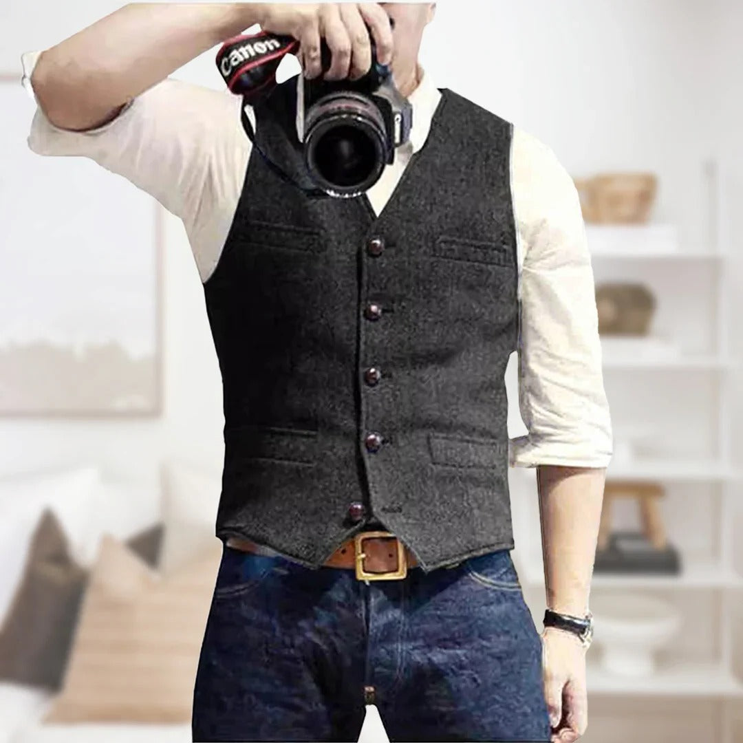 Men's sleeveless vintage denim vest with button front placket, lightweight layering essential for modern style