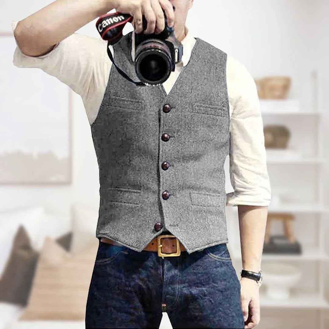 Men's sleeveless vintage denim vest with button front placket, lightweight layering essential