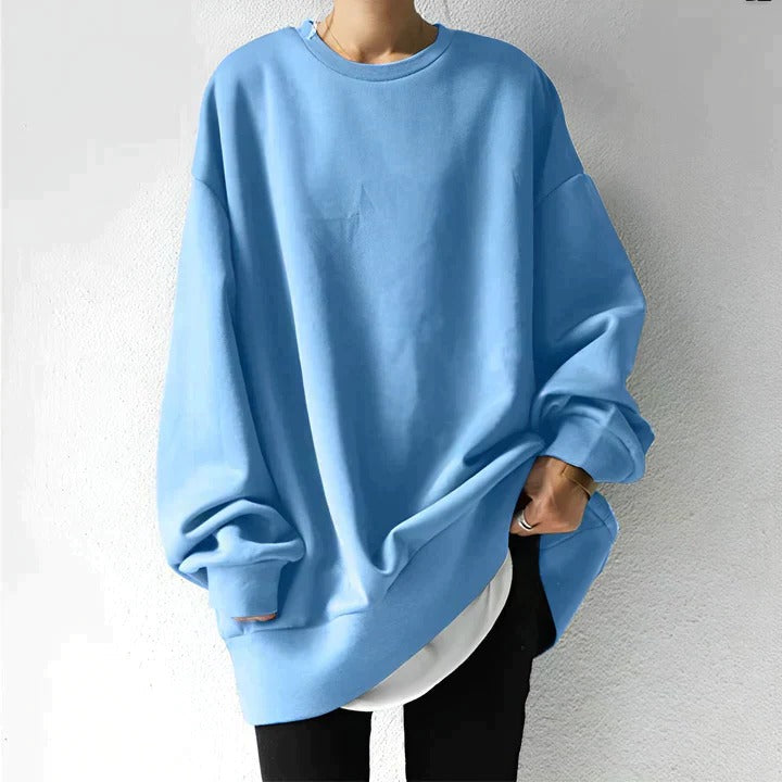 Plus-size women's oversized sweater in cozy relaxed fit, perfect for layering with jeans or leggings
