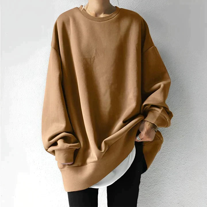 Plus-size women's oversized sweater cozy relaxed fit ideal for layering with jeans or leggings