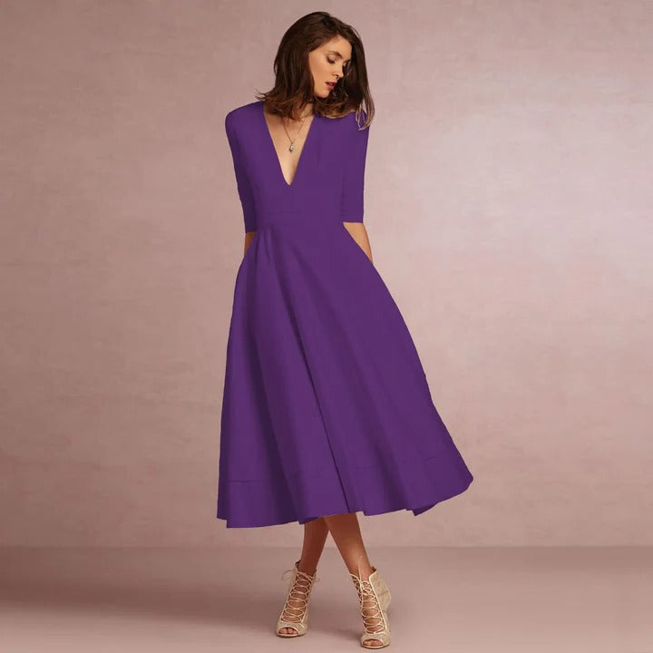Women's sleeveless princess-cut dress with fitted bodice and sweeping full-length elegant skirt