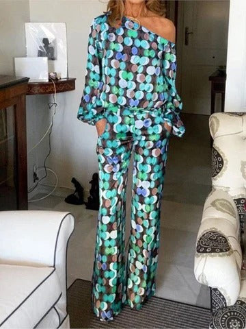 Women's colorful two-piece set with flowing printed top and wide-leg pants for effortless style