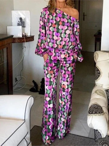 Women's colorful two-piece set with flowing printed top and wide-leg pants, relaxed chic silhouette