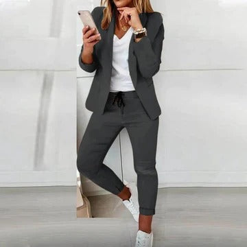 Women's tailored blazer and trousers set in coordinated style with structured silhouette for officewear