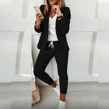 Women's tailored blazer and trousers set in coordinated style with structured silhouette for polished officewear