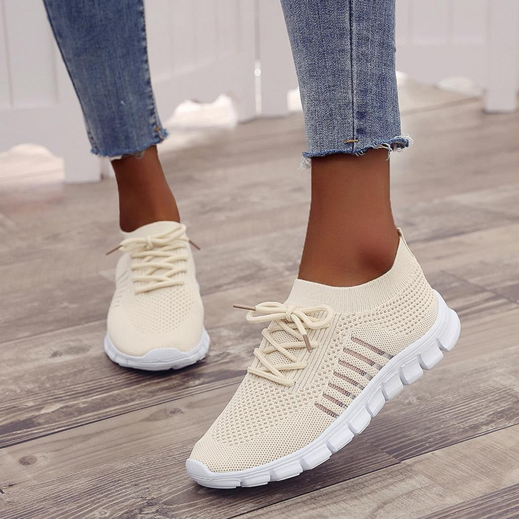 Women's white comfort support sneakers with cushioned sole and elevated heel for all-day stability