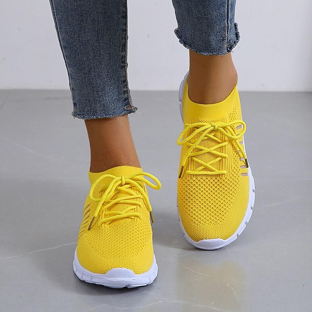 Women's white cushioned support sneakers with structured sole for all-day comfort and stability