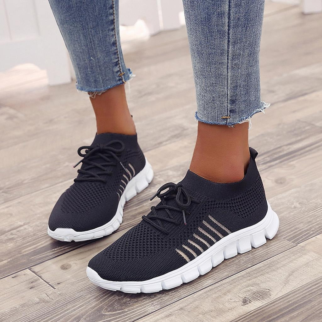 Women's white comfort walking sneakers with cushioned sole and structured full-foot support design