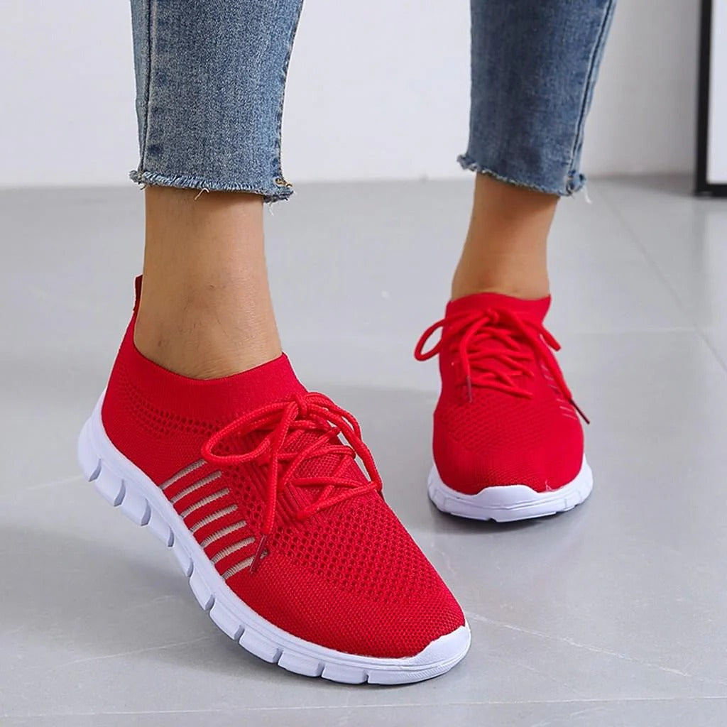 Women's white comfort support sneakers with cushioned sole, structured fit, and elevated heel