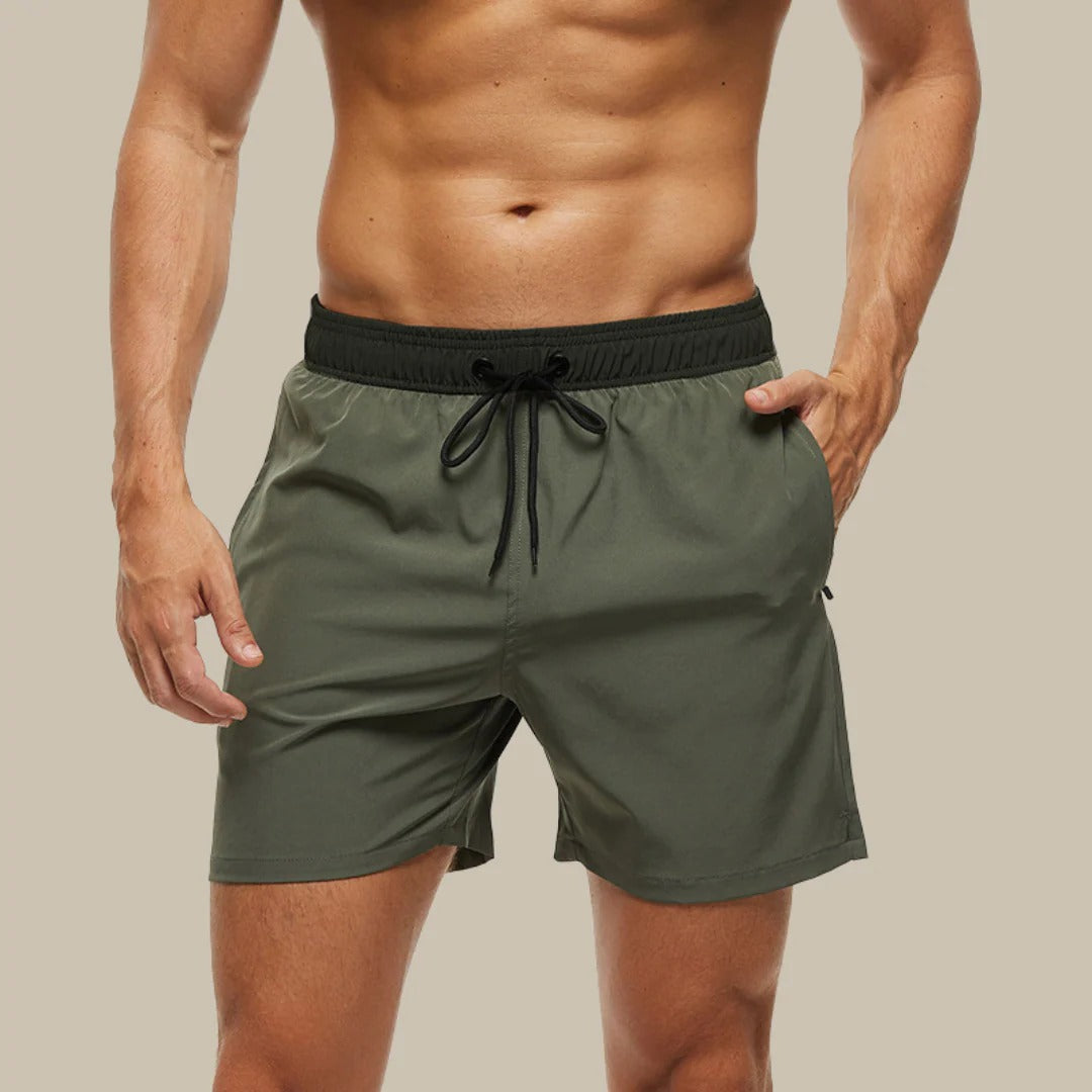Men's navy blue lightweight swim shorts with quick-dry fabric, ideal for beach and water sports