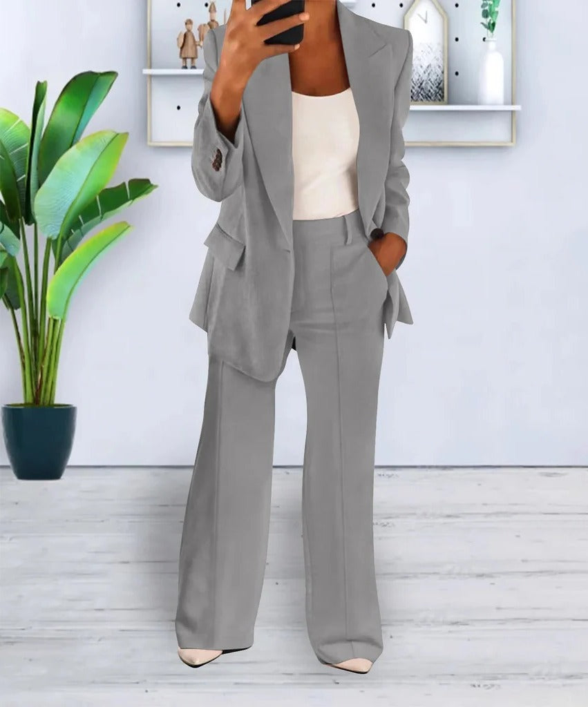 Women two-piece structured jacket top and matching trousers set, clean professional silhouette everyday wear