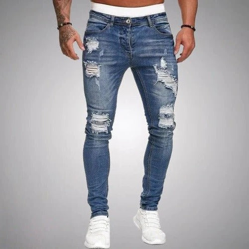 Men's slim fit ripped jeans in distressed denim with edgy torn knee detailing for day-to-night wear