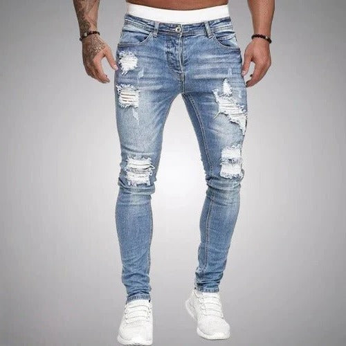 Men's slim fit ripped jeans distressed denim with bold rip accents for day-to-night versatile style