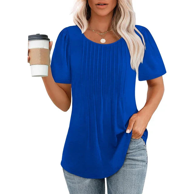 Women's white lightweight pleated blouse with soft crew neckline, airy summer chic everyday style
