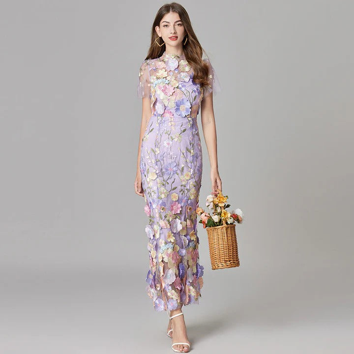 Women's sleeveless floral midi dress in elegant print, flowing silhouette perfect for weddings and garden events