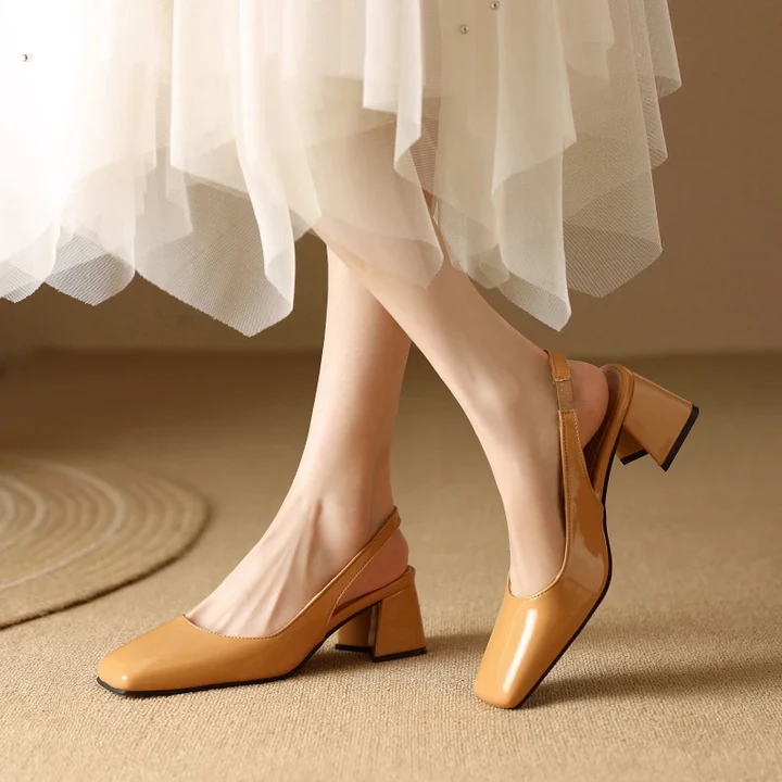 Women's faux leather slingback block heel pump with secure strap, versatile day-to-night style